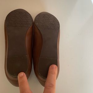 Brown slip on flats.